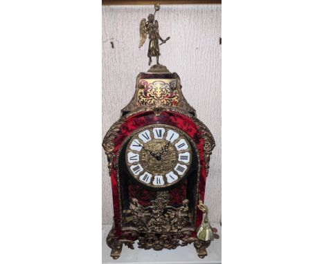 A boulle mantel clock with brass mounts. Movement marked to back Lauris. 86cm h x 39cm w x 15.5cm d. 