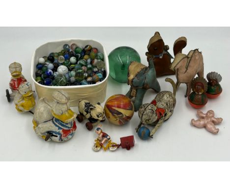 A variety of vintage toys and approx. 265 marbles to include three leather rattles, a Budgie Toy Noddy and his Trailer, a win