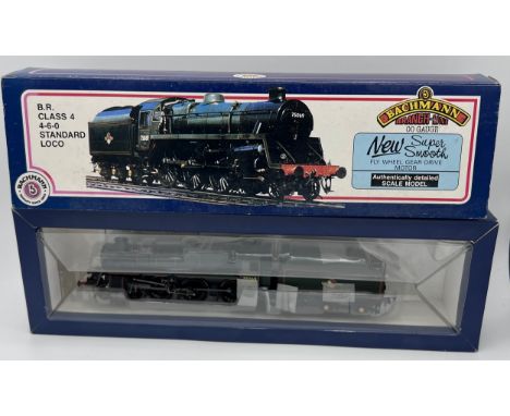 A Bachmann Branchline OO gauge Standard Class 4 locomotive, with double chimney, 75020, BR line black, 4-6-0, 31-103 together