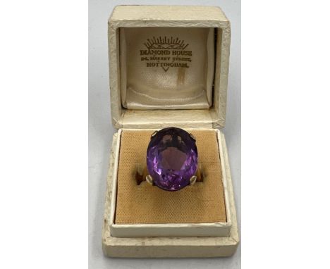A nine carat gold ring set with amethyst. Size L. weight 8.5gm. 