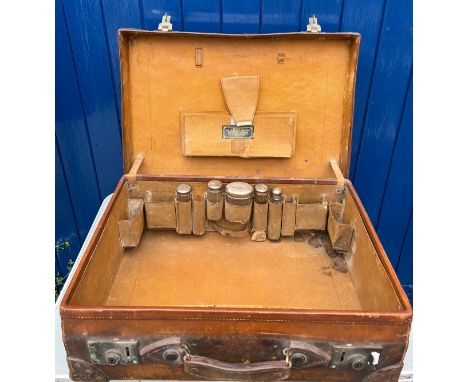 A vintage leather suitcase initialed R.W, together with 5 silver lidded glass jars. Birmingham 1912. 60cm wide, 43cm high, 19