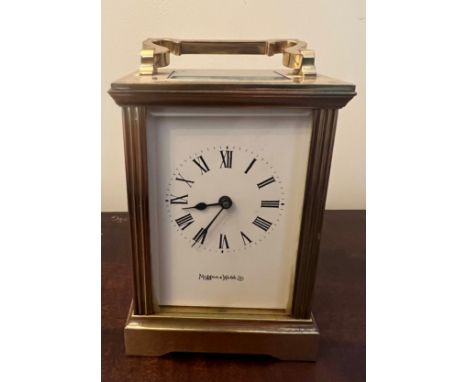A brass cased carriage clock with visible escapement marked Mappin &amp; Webb to face. 11cm h. 
