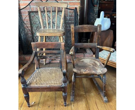Three vintage children’s chairs to include rocker, cane seated armchair and a high chair, height to back 84cm. 