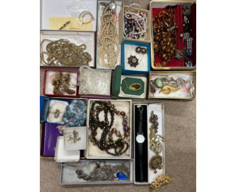 A quantity of vintage costume jewellery to include earrings, glass bead necklaces etc and a 9 carat gold bar brooch set with 
