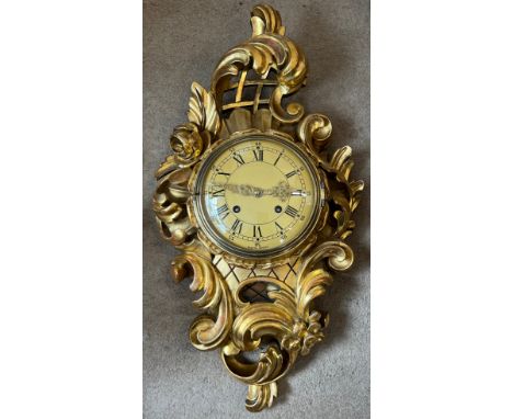 A Cartel gilt wood wall clock. 62cm h x 37cm w. 