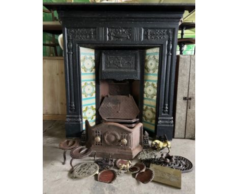 A Victorian cast iron fireplace with tiled insert together with trivets, fender, early 20thC racehorse horseshoes etc. Firepl