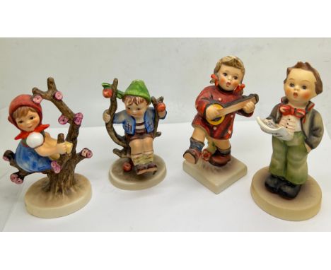 Four Hummel Goebel figures to include Soloist, Happiness, Apple Tree Girl, with box and Boy in Apple Tree. 