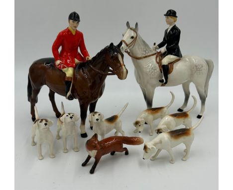 Beswick - A Hunting set consisting of Huntsman model no. 1501, Huntswoman model no. 1730, six hunting hounds and a fox togeth