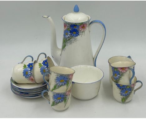 A Shelley Art Deco part coffee set with blue and pink floral decoration, pattern no B.12216 to base comprising coffeepot, jug