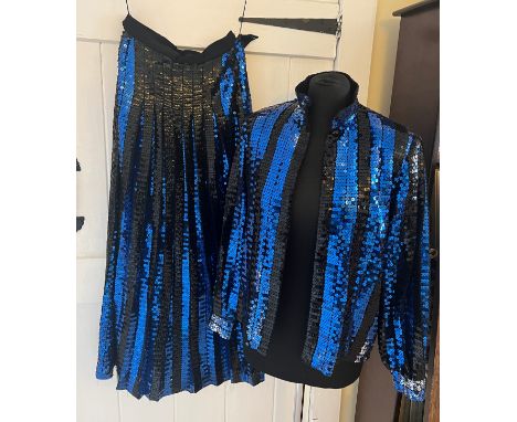 A blue and black sequinned Caroline Charles evening skirt and blouse. Labelled size 12. 