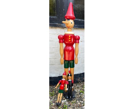 Three vintage Pinocchio models. Tallest 113cm. 