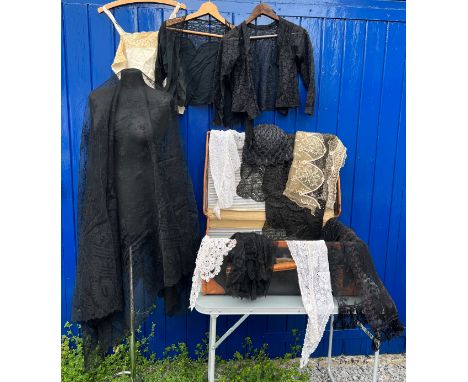 A large quantity of mainly 19thC lace, collars and blouses, together with a vintage leather and canvas suitcase 66cm long, 42