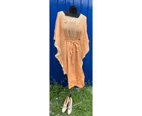 A vintage early 20thC silk and lace nightgown with tie to waist together with a pair of 19thC satin shoes. 