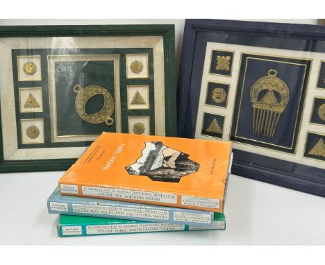 Two framed cases containing Nigerian fasteners and comb together with three Nigerian books ' An Introduction to Nigerian Trad