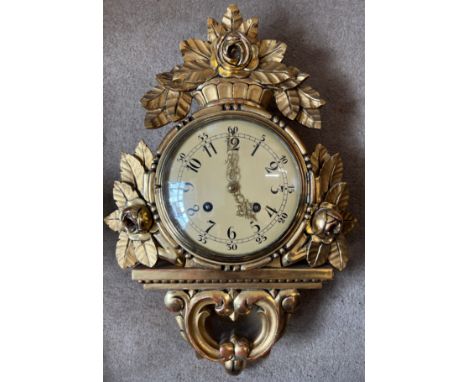 A 20thC Cartel gilt wood wall clock dated 1947. 50cm h x 34cm w. 