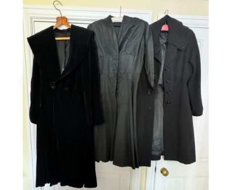 Vintage costume to include a black beaded woollen coat, circa 1940's, a black velvet coat and a black dress.Beaded coat shoul