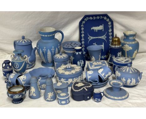 A quantity of Wedgwood Jasperware, blue and dark blue to include a tall jug with lily of the valley pattern 21cm h, a coffee 