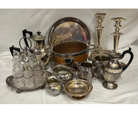 A quantity of silver plated items to include a pair of candlesticks, 2 x coffee pots, teapot, sugar, 3 x jugs, tray, presenta