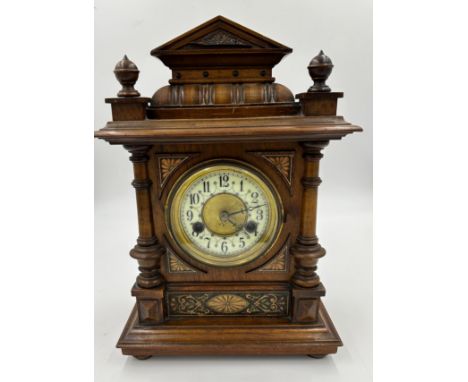 An early 20thC Hamburg American Clock Company (H.A.C.) mahogany bracket clock with inlay to front and enamel and gilt face, 1