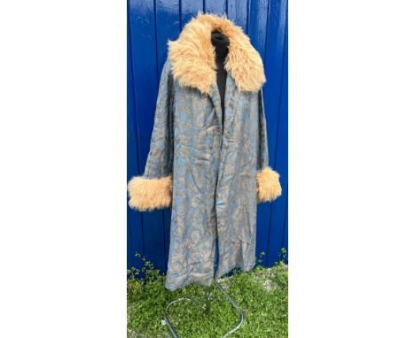 A vintage blue and metallic fabric coat with fur collar and cuffs. 