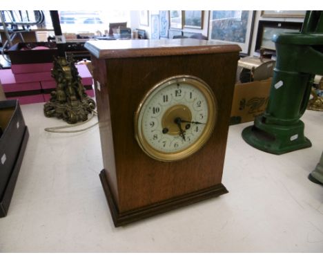 A French oak cased clock, movement marked Maple &amp; Co