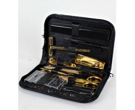 Pierre Cardin, leather cased travelling vanity set, comprising razor, comb, scissors, nail file etc.