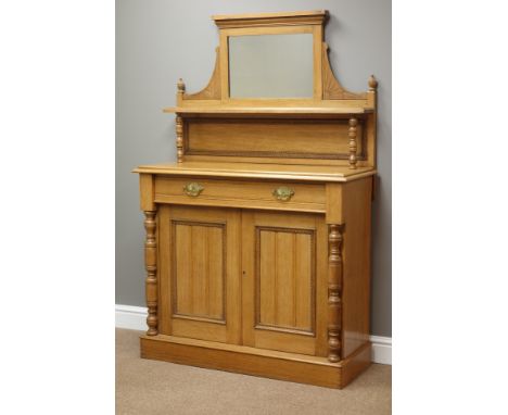 Edwardian light oak chiffonier, raised mirror back with turned supports and carved detail, single drawer and double cupboard,
