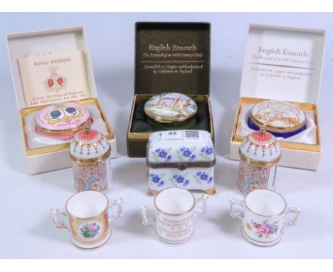 Three Crummles enamel trinket boxes, two Crummles coronation enamel stamp boxes, three miniature Royal Crown Derby loving cup