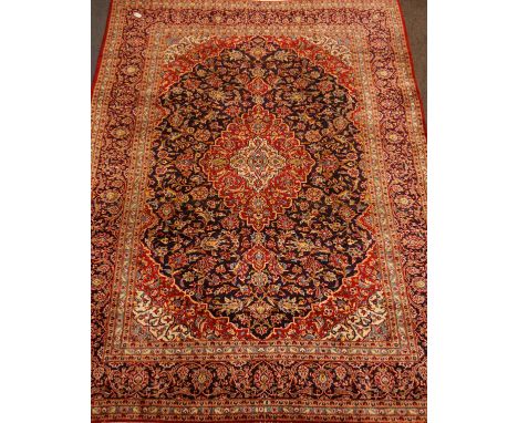 Persian Kashan blue and red ground rug carpet, interlacing floral design, 350cm x 263cm   Condition Report   Click here for f