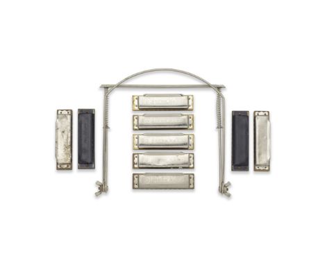 Rory Gallagher: A Group Of Harmonicas And A Holder,Comprising: nine harmonicas, all by Hohner, seven Blues Harp and two Pro H