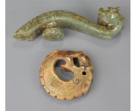 One celadon jade belt hook and another jade item in the form of a dragon