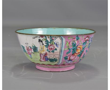 A Canton enamel bowl decorated with figures and flowers. 13.5cm diameter