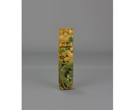 A yellow and green carved jade belt hook. 13cm x 3cm 