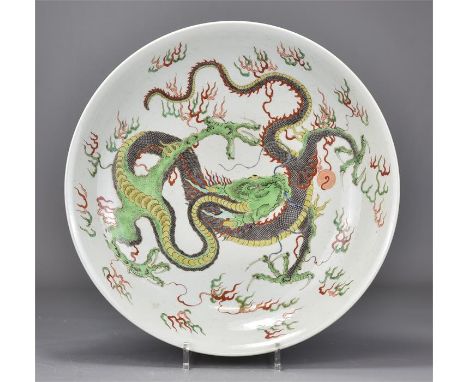 A large Chinese famille verte porcelain dragon dish. Kangxi period (1662-1722). 38cm diameter 