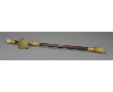 An early 20th century Chinese bamboo opium pipe fitted with gilded metal and jade. 55cm  