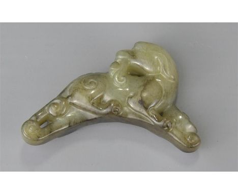 A carved celadon jade dog. 6cm 