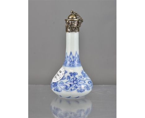 A small Chinese Kangxi blue and white porcelain vase mounted with a silver colour cover. 9.5cm tall 