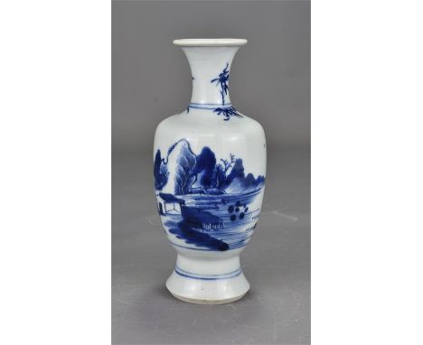 A Chinese blue and white porcelain vase Kangxi period. Painted with a lake scene. 18cm tall