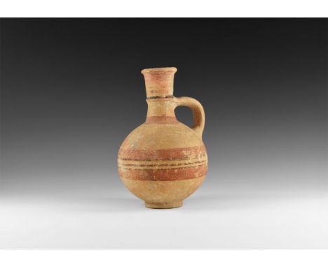 Mid 4th-mid 3rd millennium BC. A ceramic jug with globular body, basal ring, tubular neck with collet and rolled rim; single 