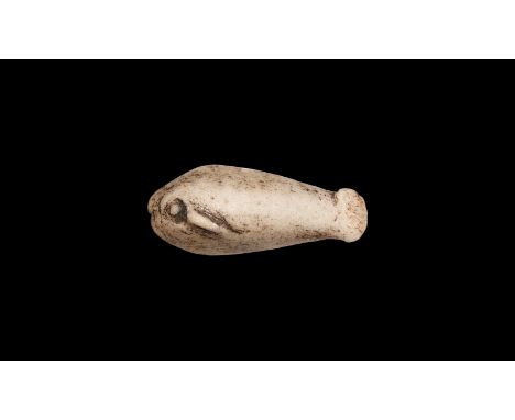 Ptolemaic Period, 332-30 BC. A grey glazed composition amuletic fish with large pellet eyes, lateral fins, small rounded tail
