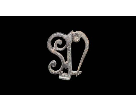 1st-2nd century AD. A bronze dolphin brooch with large curled S to the back plate; pin and catchplate to the underside.  27 g