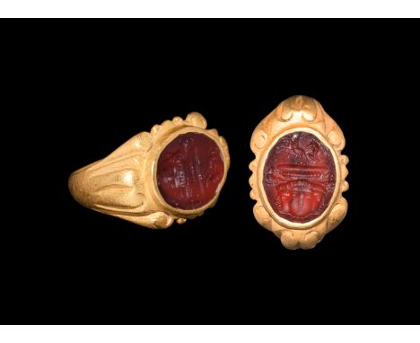 2nd-3rd century AD. A carnelian cloison with intaglio triune female faces of Luna (Selene) with birds above and beaded band, 