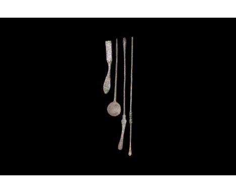 1st-2nd century AD. A group of bronze medical instruments consisting of a short scalpel with wide angled blade; a spoon with 