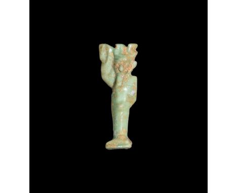 Third Intermediate Period, 1069-702 BC. A green glazed composition amuletic pendant of the god Min with flail in his right ha