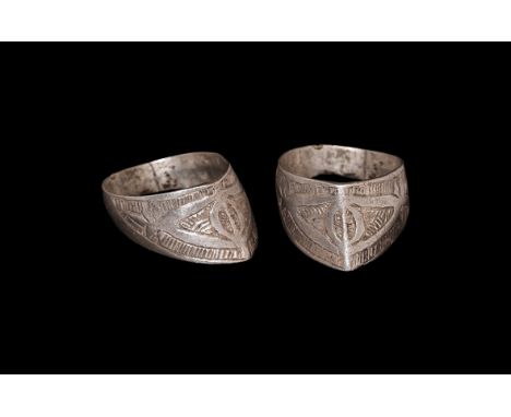 12th century AD. A silver archer's ring with a pointed and angled bezel; the band D-shaped in cross-section; the front of the