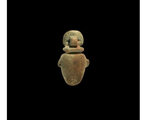 New Kingdom, 1550-1070 BC. A large blue glazed composition heart amulet with disc above and loop to the reverse. Cf. Andrews,