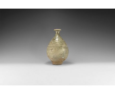 Yuan Dynasty, 1271-1368 AD. A piriform ceramic vase with flared and rolled rim, green glaze with circumferential band of swir