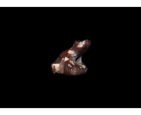 Amarna Period, 1352-1336 BC. An agate amulet of a seated frog with hole for suspension through the base. Cf. Andrews, C. Amul