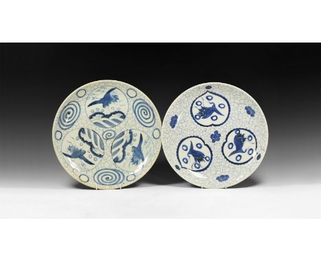 19th century AD. A pair of large glazed ceramic plates, one with leaf-shaped panels bearing cranes and annulets on a crazed f