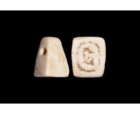 Late Period, 664-332 BC. A carved marble(?) pyramidal pendant stamp seal with hieroglyphic character, possibly -t indicating 